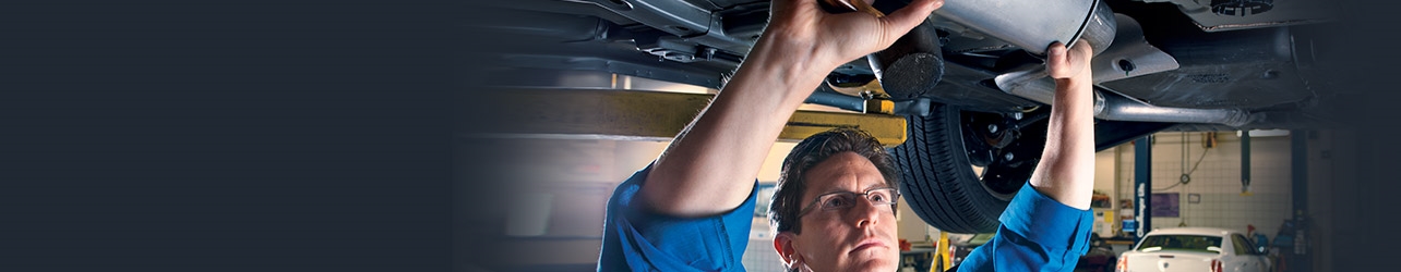 man inspecting vehicle